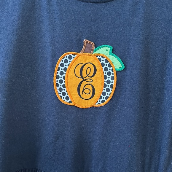 Primary black pocket dress size 14 with E pumpkin patch sewn on. Worn once. - Picture 4 of 4